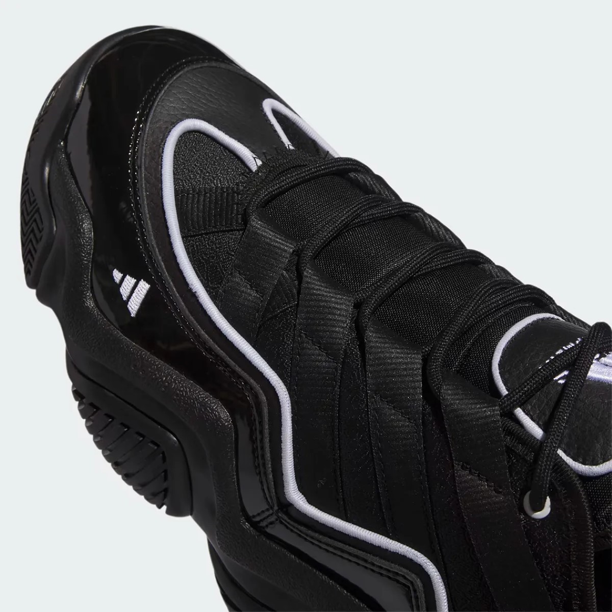 The sleek resurgence of the adidas Top Ten 2010 in black patent leather