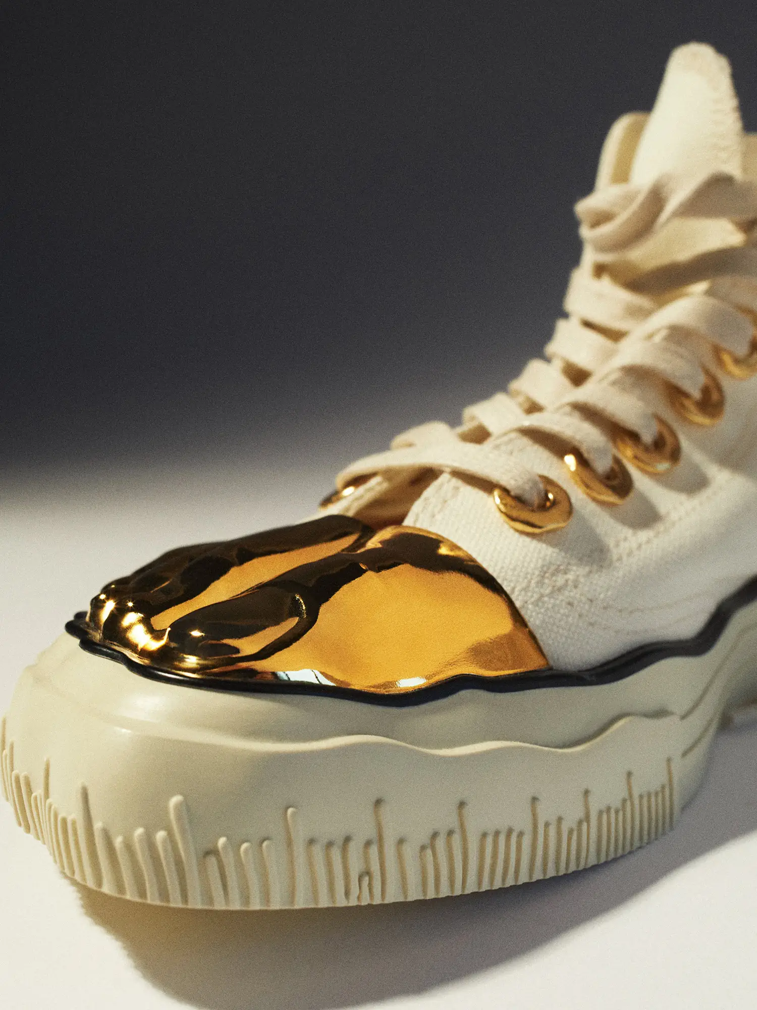 Schiaparelli debuts "Gold Toe Trainers," its first-ever sneaker